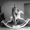 Max Ernst with rocking horse, Paris, 1938